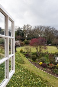 View of the gardens and tennis court from the second floor window. National Trust/Andrew Butler
